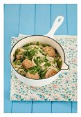 Smoked fish balls with tagliatelle, peas and chervil