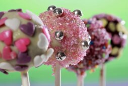 Cake pops, chilled and decorated with sugar strands