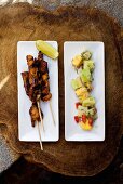 Grilled chicken kebabs with a fruity cucumber salad