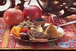 An arrangement of spices with pomegranates (Arabia)