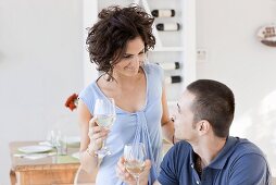 A woman and a man drinking wine