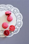 Raspberry macaroons on a paper doily