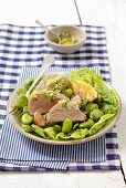 Pork fillet with lima beans and herb sauce