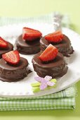 Petit fours with chocolate and strawberries