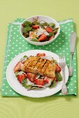 Red beet salad with strawberries and grilled salmon