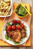 Grilled pork chop with cherry tomatoes
