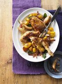 Roast chicken with bacon, pears and potatoes