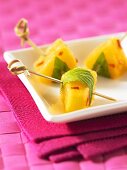 Spicy chilli and pineapple cubes on sticks