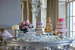 A cake buffet with wedding cakes