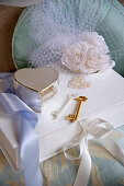 Wedding accessories: a jewellery box, keys and silk flowers
