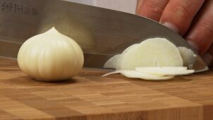 Chopping Asian garlic