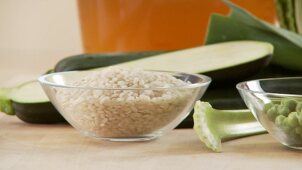 Ingredients for minestrone (vegetables, bacon, risotto rice)