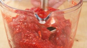 Raspberries being pureed