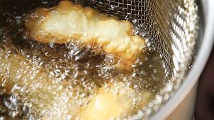 Fish fillets in a frying basket