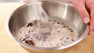 Hot milk being mixed with chocolate