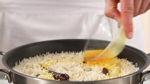 Saffron solution being added to rice