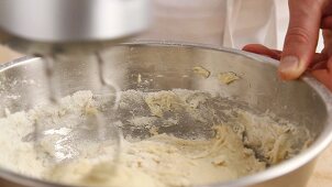 Yeast dough being kneaded with dough hooks