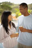 Couple with drinks in the open air