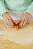 Pressing a Cookie Cutter into Dough