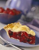 A slice of triple berry pie