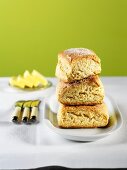 Three Scones, Stacked, with Butter and Butter Knives