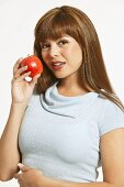 Young Woman Holding Red Apple