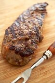 Close Up of Grilled Top Sirloin Steak on a Cutting Board