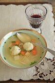 Bowl of Matzoh Ball Soup with Wine