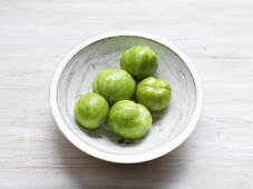 Green Heirloom Tomatoes in a Wooden Bowl