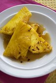 Grilled Pineapple Slices on a White Plate; From Above