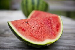 Fresh Watermelon Wedges on Wooden Outdoor Table