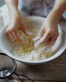 Hands Mixing Flour and Butter