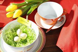 A colourful arrangement of flowers with an Easter breakfast