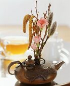 A spring flower arrangement in a ceramic pot