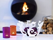 Floral shaped plastic bowl and tea lights with a colorful fabric cover
