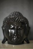 A black wooden Buddha head