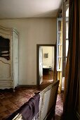 View from a living room into a country style bathroom with a terracotta floor