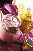 Moroccan tea pots in pink and yellow