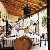An antiques collection on the terrace of a rustic country house