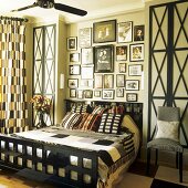 A bed with a black wooden grid-patterned frame and built-in bedside tables