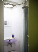 Bathroom with a wash basin and a shower area