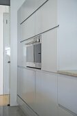Integral oven in fitted units in modern kitchen