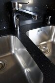 Chrome tap fitting above double kitchen sink