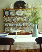 Dining room with wood sideboard and antique place