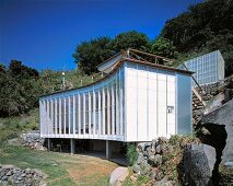 A newly built house with a curved facade on a hillside - House Izu by Atelier Bow-Wow, Tokyo, Japan