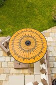 A view of a yellow sunshade on a terrace