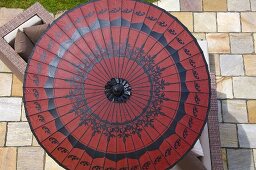 A view of a red sunshade on a terrace