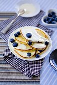 Pancakes with blueberries and yogurt sauce