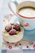 Meringue shell with raspberries and custard, with coffee