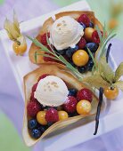 Fruit salad with vanilla ice cream in wafer shells